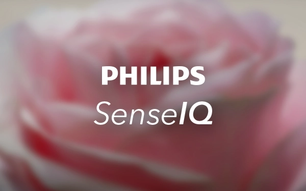 Графіка Philips SenseIQ на рожевому квітковому фоні, що символізує інтелектуальну технологію налаштування щітки