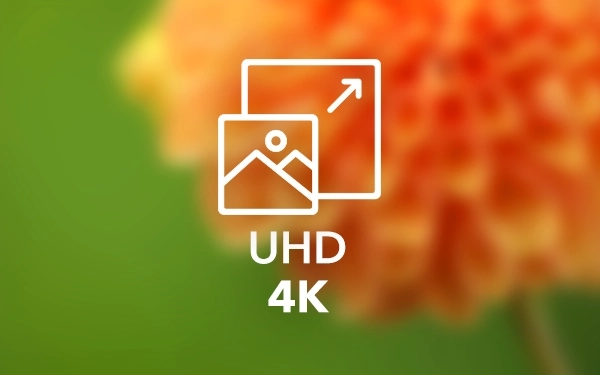 Значок UHD 4K на зелено-помаранчевому фоні – символ роздільної здатності зображення
