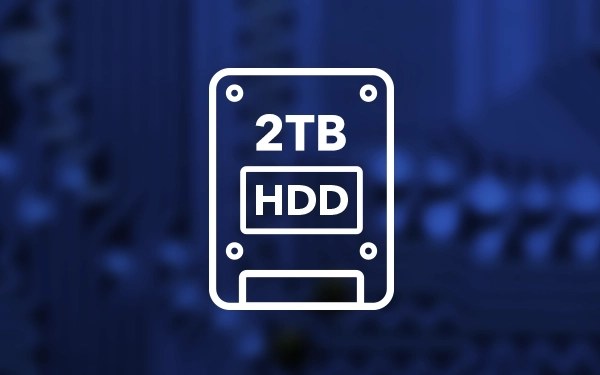 Ikona dysku zewnętrznego HDD (Hard Disk Drive) z oznaczeniem pojemności 2 TB na niebieskim, technicznym tle