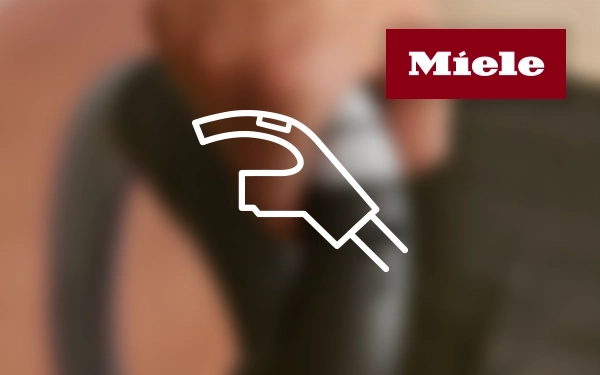 Логотип Miele та значок ручки пилососа зі шнуром &ndash; символ ергономічного керування